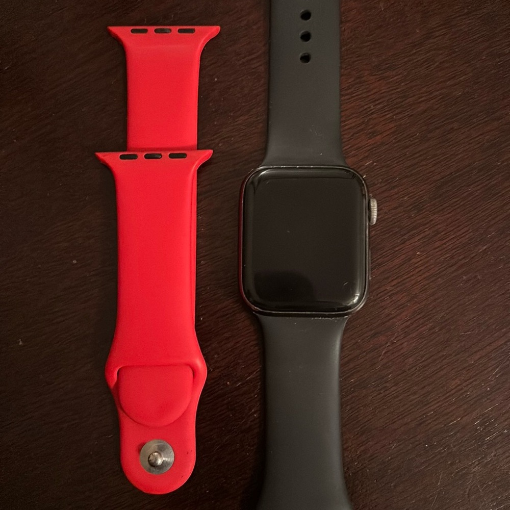 Apple Watch Series 4 in titanium. Comes with box, black and red silicone strap